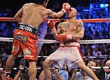 Pacquiao TKOs Cotto in 12